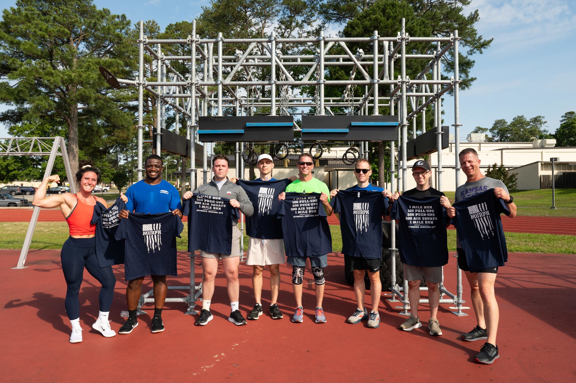 Participants pose for a group photo during the annual Murph Challenge at Seymour Johnson Air Force Base, North Carolina, May 17, 2024. The Murph Challenge begins with a one mile run followed by 100 pull-ups, 200 push-ups, 300 air squats and ending with another one mile run. (U.S. Air Force photo by Airman Rebecca Tierney)