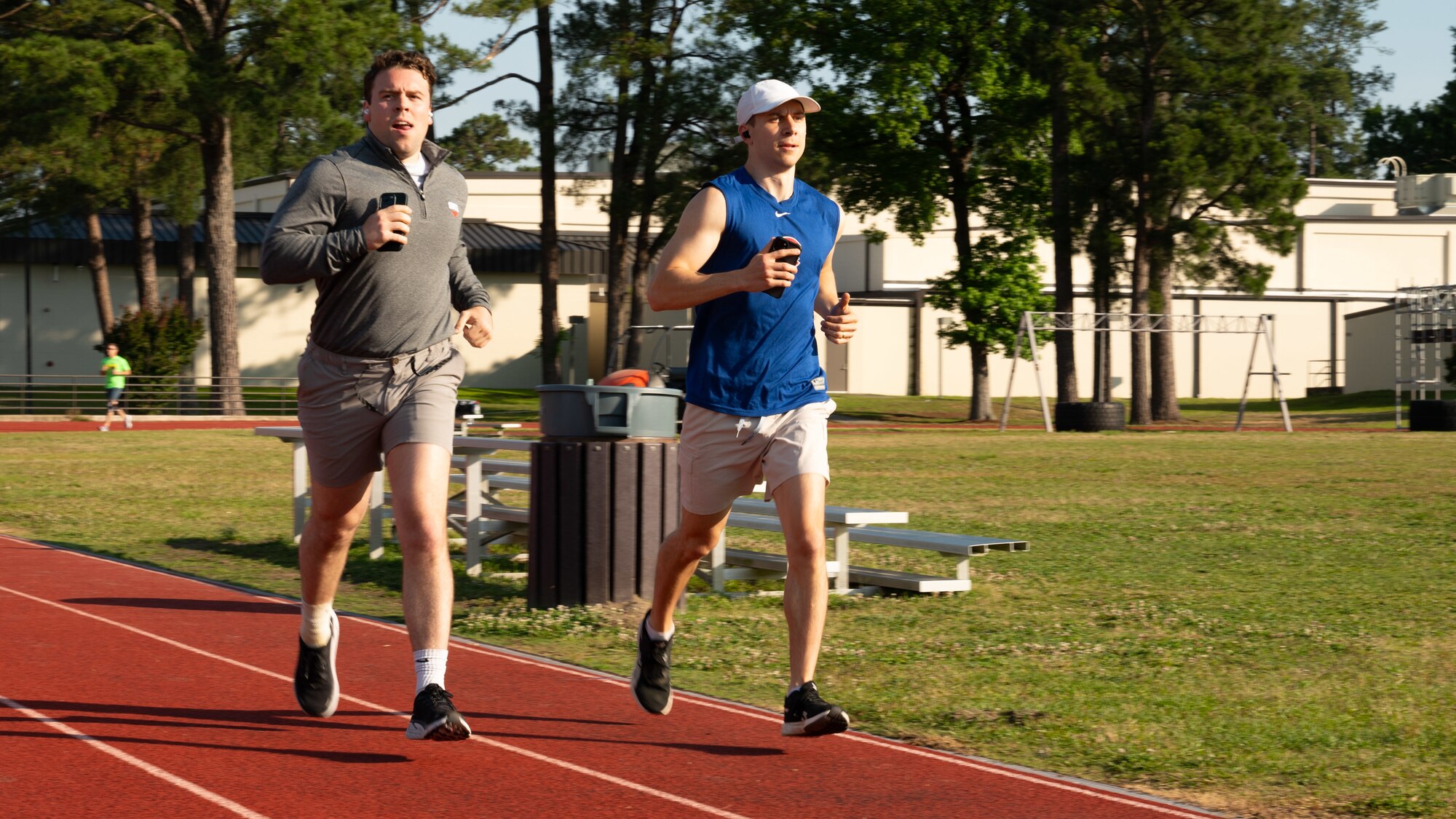 U.S. Air Force 1st Lt Jonathan Arnold, 4th Fighter Wing Judge Advocate chief of civil law, runs alongside Capt. Oliver Batkoff, 4th Fighter Wing Judge Advocate chief of adverse actions, participates in the annual Murph Challenge at Seymour Johnson Air Force Base, North Carolina, May 17, 2024. The Murph Challenge begins with a one mile run followed by 100 pull-ups, 200 push-ups, 300 air squats and ending with another one mile run. (U.S. Air Force photo by Airman Rebecca Tierney)