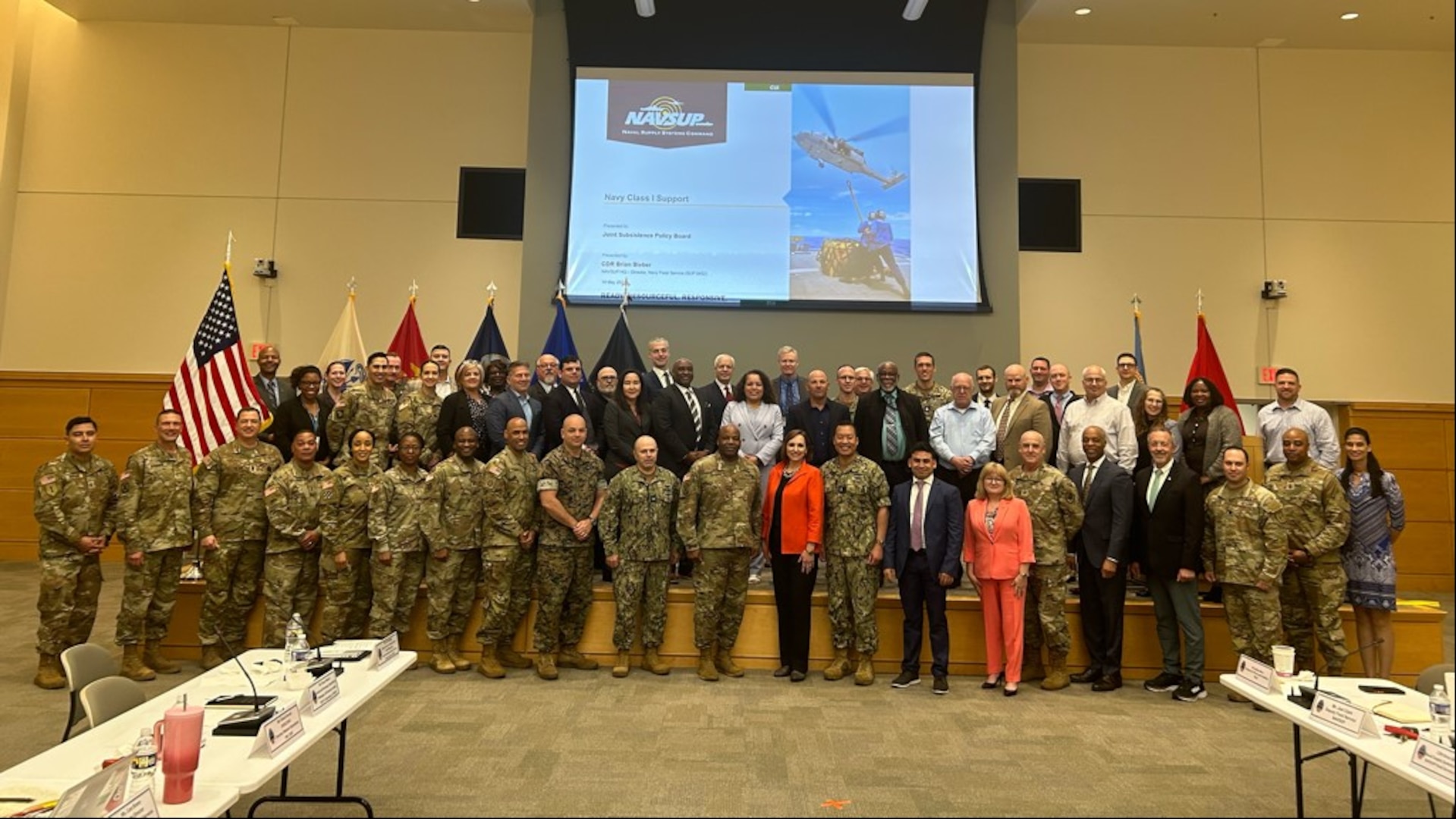 Joint Subsistence Policy Board and Subsistence Global Summit participants take a group photo at DLA Troop Support.