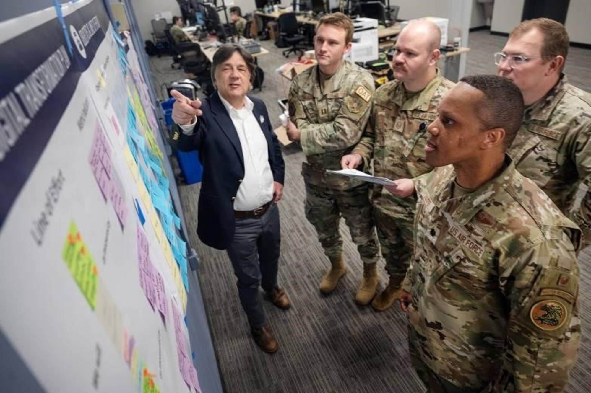 Lt. Col. Chaz LeDeatte, 9th Air Force (Air Forces Central) deputy chief of staff and chief technology and data officer, reviews notes and data on a digital transformation board alongside members of his Command Technology and Data Office (CTDO) team “Battle Lab” Mar. 19, 2024, at Shaw Air Force Base, S.C. The AFCENT ‘Battle Lab’ provides a space and capability where Airmen can innovate and cultivate ideas, and work with the CTDO to obtain resources to engineer, refine, and validate their requirements throughout the command. (U.S. Air Force photo )