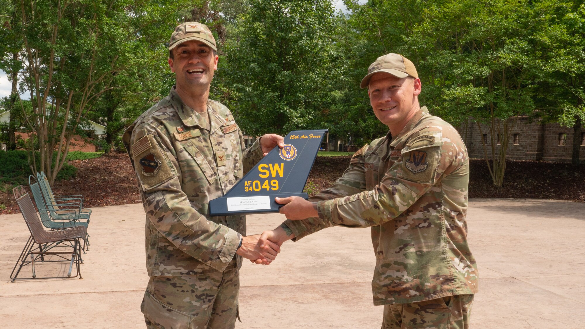 U.S. Air Force Col. Morgan Lohse, 4th Fighter Wing commander, presents the Honor Guard Program Manager of the Year Award to Master Sgt. Kyle Cisco, 4 FW Honor Guard program manager, at Seymour Johnson Air Force Base, North Carolina, May 16, 2024. The annual award recognizes the program manager who made the most impact on the base Honor Guard. (U.S. Air Force photo by Airman Rebecca Tierney)
