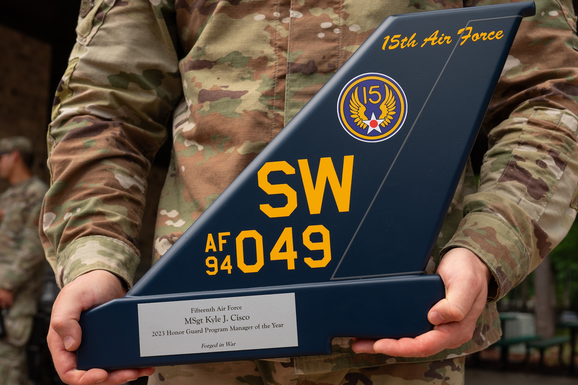 U.S. Air Force Master Sgt. Kyle Cisco, 4th Fighter Wing Honor Guard program manager, holds the Honor Guard Program Manager of the Year Award at Seymour Johnson Air Force Base, North Carolina, May 16, 2024. The annual award recognizes the program manager who made the most impact on the base Honor Guard. (U.S. Air Force photo by Airman Rebecca Tierney)