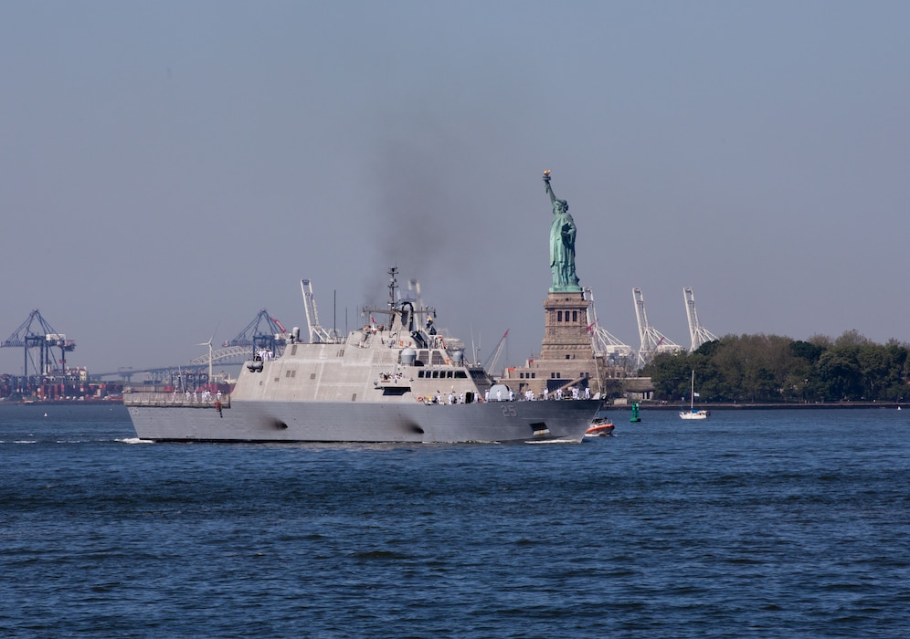 USS Marinette (LCS 25) sails past the Statue of Liberty.