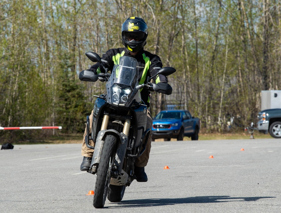 An Airman rides his motorcycle on base.