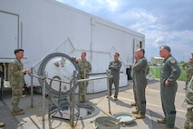 A Team Minot Airman briefs conference attendees at a Minuteman III intercontinental ballistic missile launch facility during the 2024 Air Force Global Strike Command Senior Leader Conference at Minot Air Force Base, North Dakota, May 21, 2024. The Senior Leader Conference allows senior leaders to come together and share best practices, discuss unique challenges and collaborate on solutions for issues that affect the Global Strike mission and its people. (U.S. Air Force photo by Airman 1st Class Trust Tate)