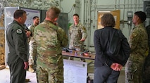 Attendees of the 2024 Air Force Global Strike Command Senior Leader Conference receive a brief on quad-copter unmanned aircraft system (UAS) capabilities at Minot Air Force Base, May 22, 2024. The UAS was displayed alongside other equipment used by security forces members who safeguard Minot AFB.