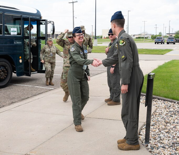 Commanders, command chiefs, civic leaders and staff from across Air Force Global Strike Command (AFGSC) are greeted during a tour in support of the 2024 AFGSC Senior Leader Conference at Minot Air Force Base, North Dakota, May 21, 2024. As part of the Senior Leader Conference, AFGSC leaders hold various meetings, with the objective being to align their efforts with the Global Strike mission. (U.S. Air Force photo by Airman 1st Class Luis Gomez)