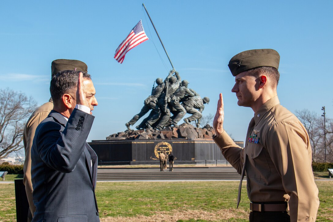 U.S. Marine Corps Major Frank "Gorda" Colpo, Director of Aviation, G3/5, Marine Corps Installations Command (MCICOM) is promoted to Lieutenant Colonel at a ceremony at the Marine Corps War Memorial in Arlington, Virgina, on Feb. 1, 2024. The newly-minted LtCol celebrated surrounded by his family, friends, and fellow Marines at the site honoring the sacrifices made by Marines in defense of the United States for more than two centuries. MCICOM exercises command and control of Marine Corps installations via regional commanders in order to provide oversight, direction, and coordination of installation services and to optimize support to the Operating Forces, tenants, and activities. (U.S. Marine Corps illustration by Matthew Wright)