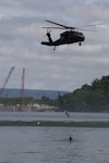 Tennessee Army National Guard Soldiers assigned to the 1-230th Assault Helicopter Battalion remove volunteers acting as victims swept into the Chickamauga Dam during a simulated flood requiring the efforts of the Helicopter Aquatic Rescue Team May 16, 2024. The training exercise was conducted with the Chattanooga Fire Department and other local emergency responders.
