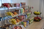 closeup of a variety of cereals, granola bars and fresh fruit