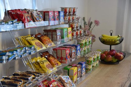 closeup of a variety of cereals, granola bars and fresh fruit