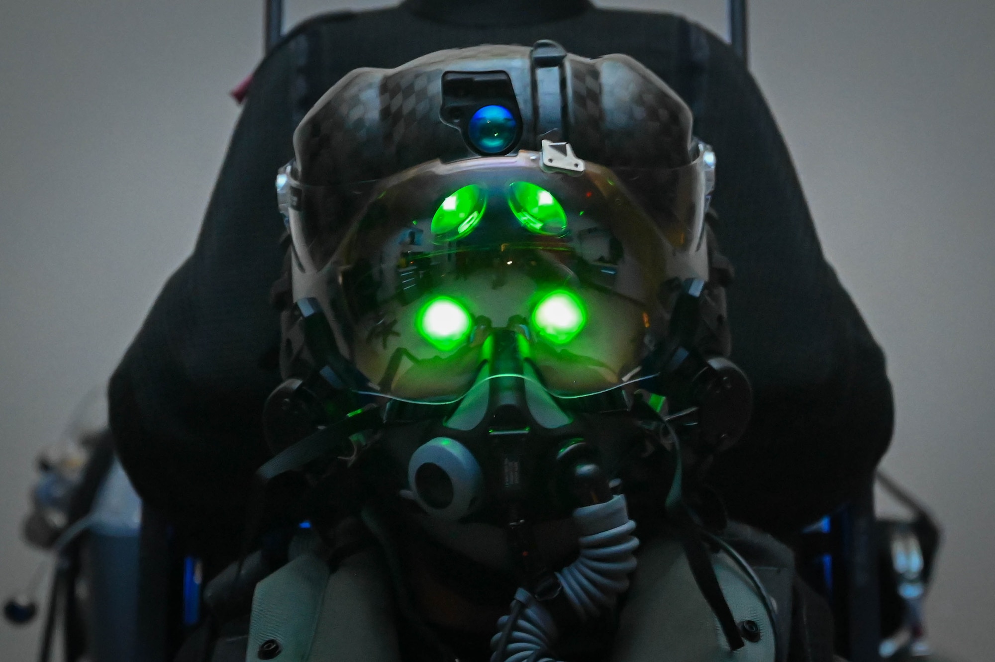 Capt. Ryosuke Sugimoto, a Japanese Air Self-Defense Force F-35 Lightning II pilot, tests the green glow of his Helmet-Mounted Display System at the pilot fit facility on May 22, 2024.