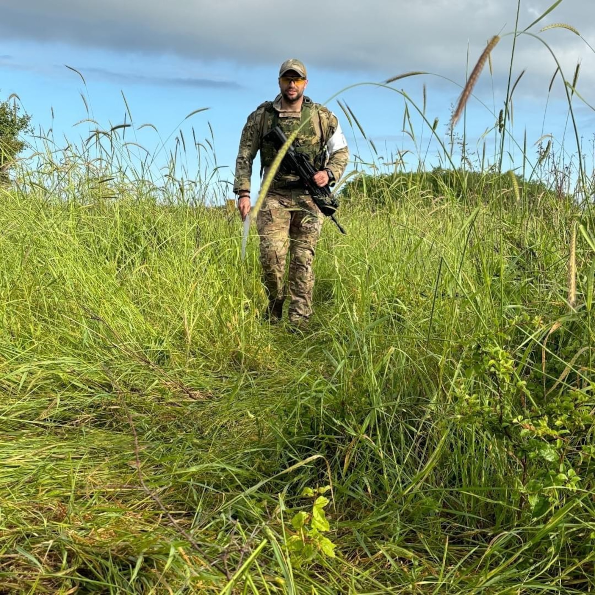 148th Fighter Wing Security Forces Specialist, Staff Sgt. Duane Southworth, approaches the first of nine obstacles during a 23-mile ruck march.