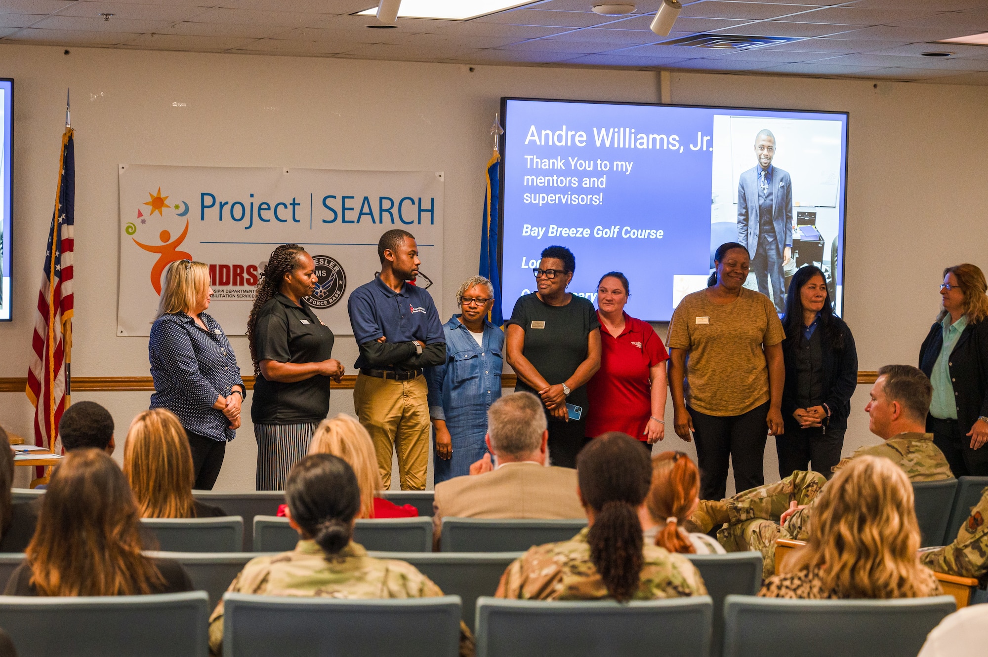 Andre Williams Jr., Project SEARCH intern, stands beside family members and mentors as he is recognized during the Project SEARCH graduation on Keesler Air Force Base, Mississippi, May 21, 2024.