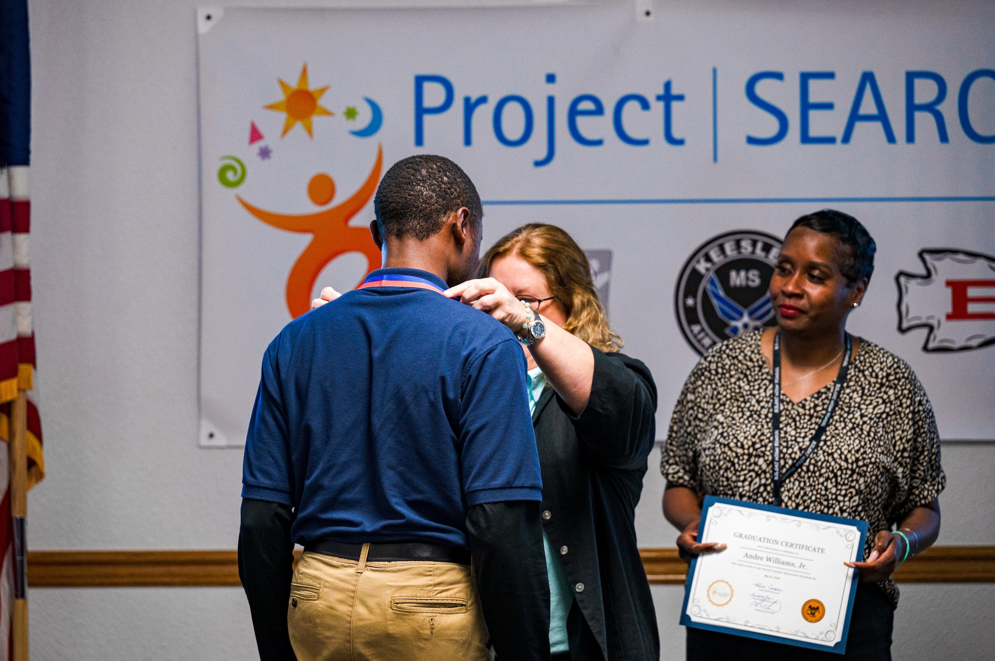 Andre Williams Jr., Project SEARCH intern, receives a medal during the Project SEARCH graduation on Keesler Air Force Base, Mississippi, May 21, 2024.