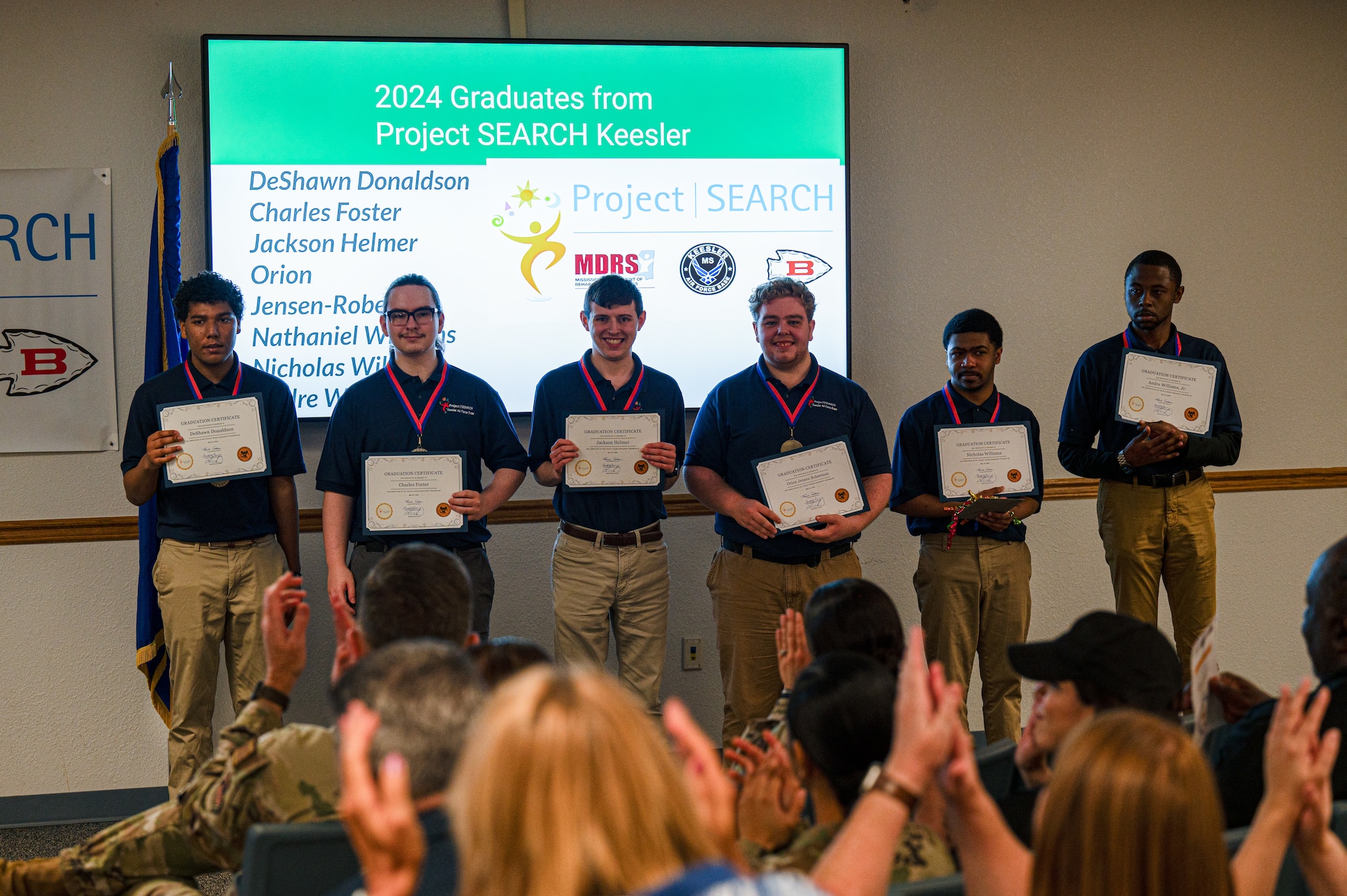 Project SEARCH interns pose with graduation certificates as they are recognized during the Project SEARCH graduation on Keesler Air Force Base, Mississippi, May 21, 2024.