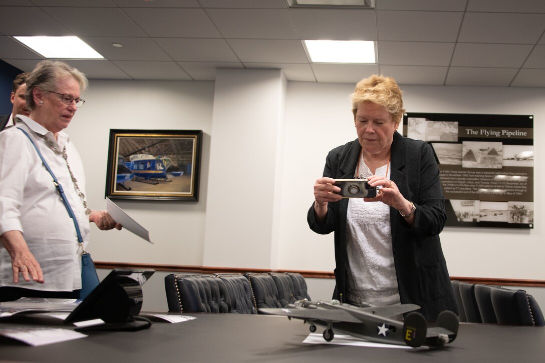 Louise Swain, left, and Anne Petrucelli, relatives of U.S. Army Lt. Gen. Frank M. Andrews, view a model of "Hot Stuff", a B-24 Liberator bomber.