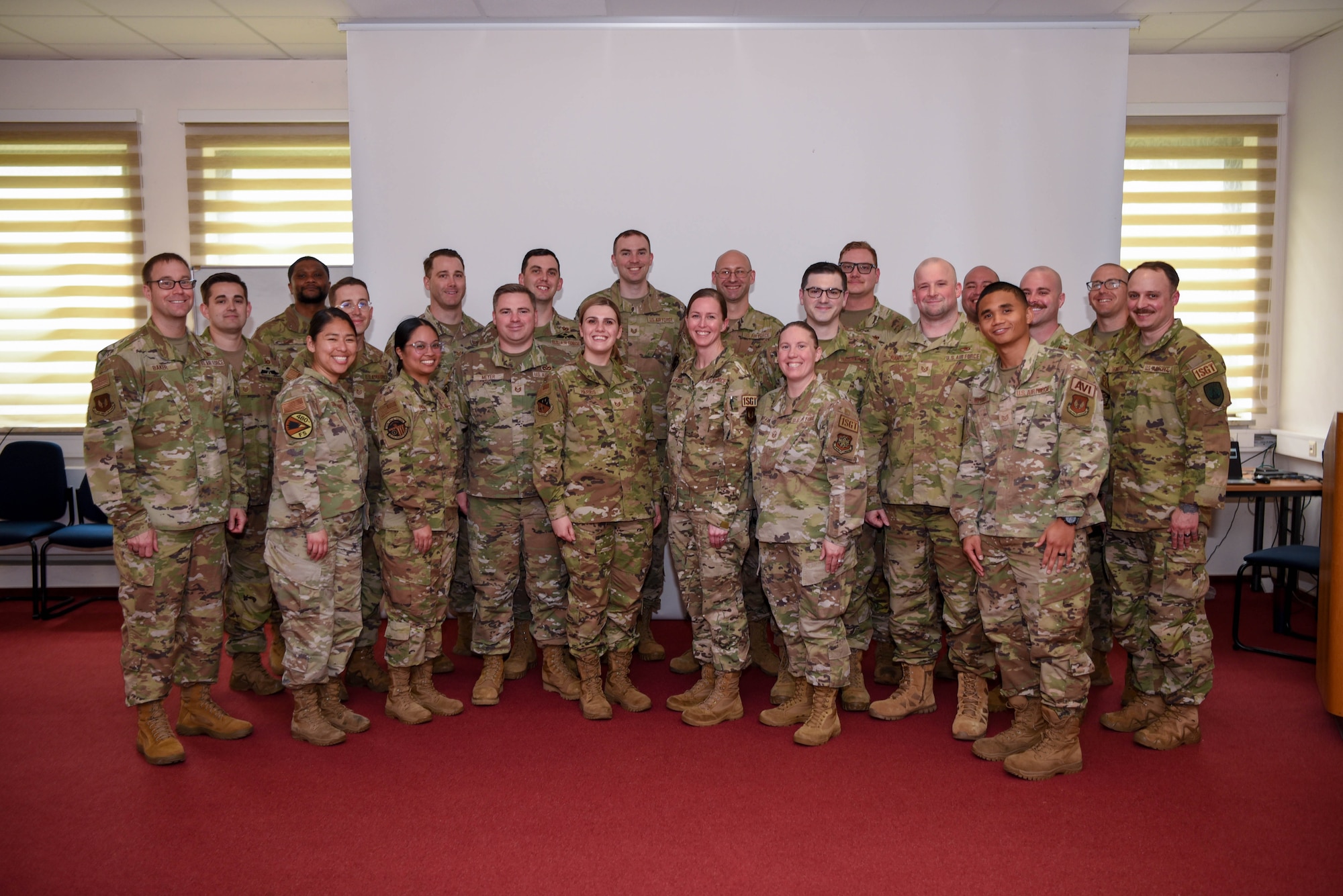 U.S. Air Force Chief Master Sgt. George Baker, U.S. Air Forces in Europe - Air Forces Africa command first sergeant, takes a group photo with attendees of a first sergeant symposium at Spangdahlem Air Base, Germany, May 23, 2024. The symposium is organized by Spangdahlem AB’s First Sergeant Council every two years to give potential future “first shirts” assigned to the base an in-depth look into the leadership position. (U.S. Air Force photo by Senior Airman Imani West)