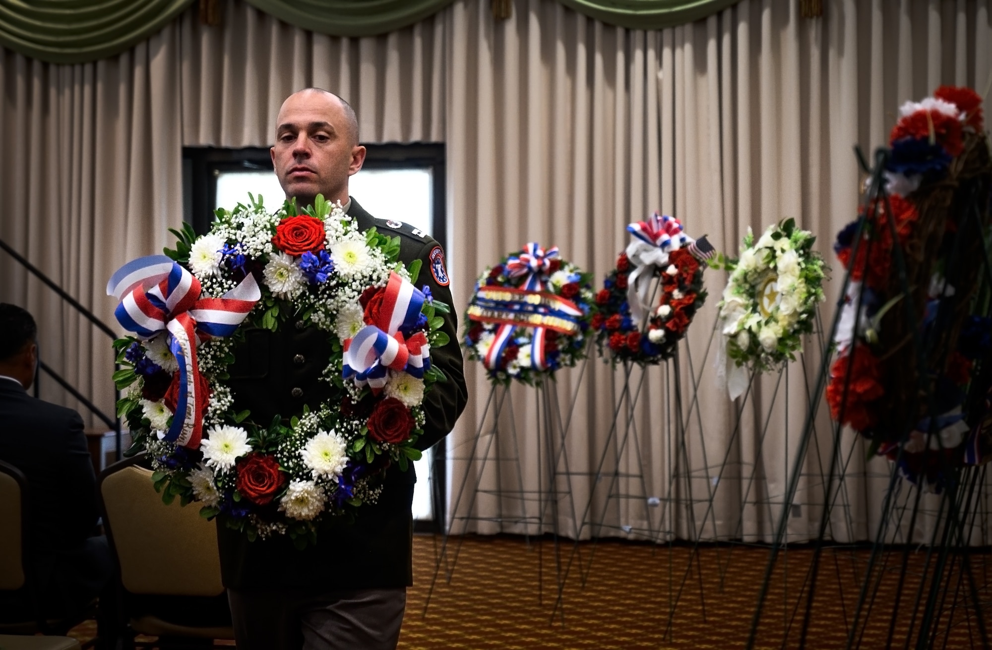 A U.S. Army Soldier lays a wreath during the Parade of Wreaths Ceremony at Joint Base McGuire-Dix-Lakehurst, N.J., May 23, 2024. The event honors service members and police personnel who have given their lives in the line of duty. (U.S. Air Force photo by Senior Airman Matt Porter)