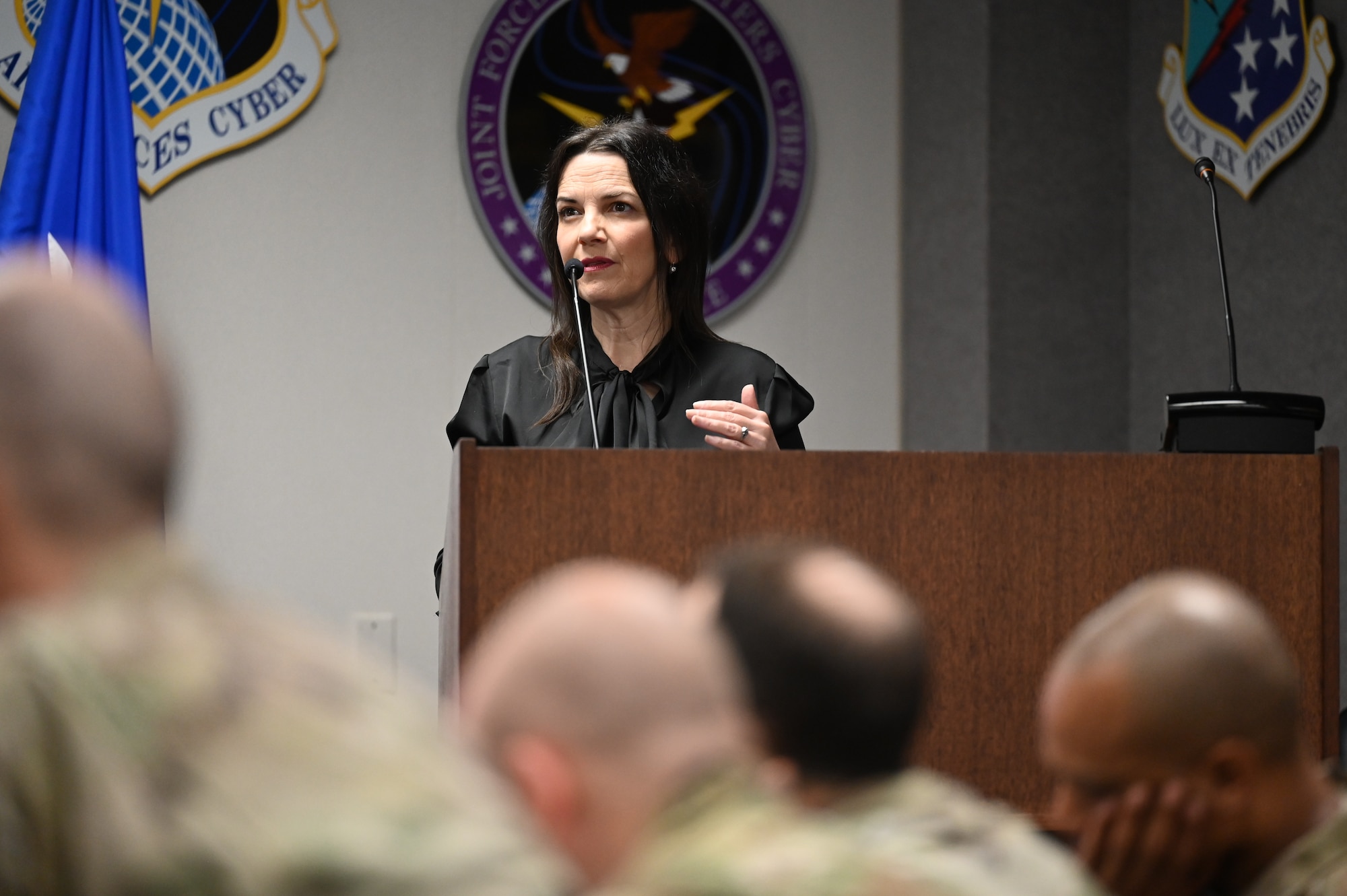 A resiliency expert speaks at a podium.