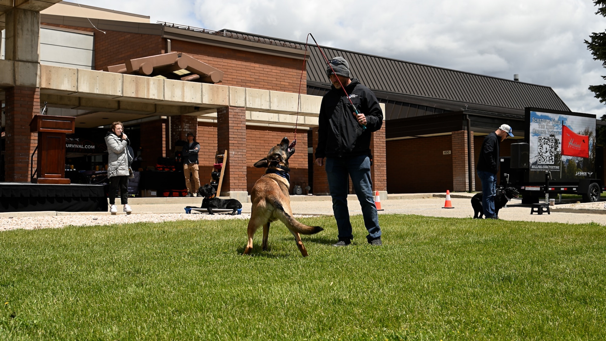 Jeff Slack, Dog Training Elite, and Yaga perform a demonstration during a Safety Fest event at Hill Air Force Base, Utah, May 23, 2024. The event provided attendees an opportunity to learn about safety with live demonstrations, training and product exhibitions from more than 40 safety-related vendors. (U.S. Air Force photo by R. Nial Bradshaw)