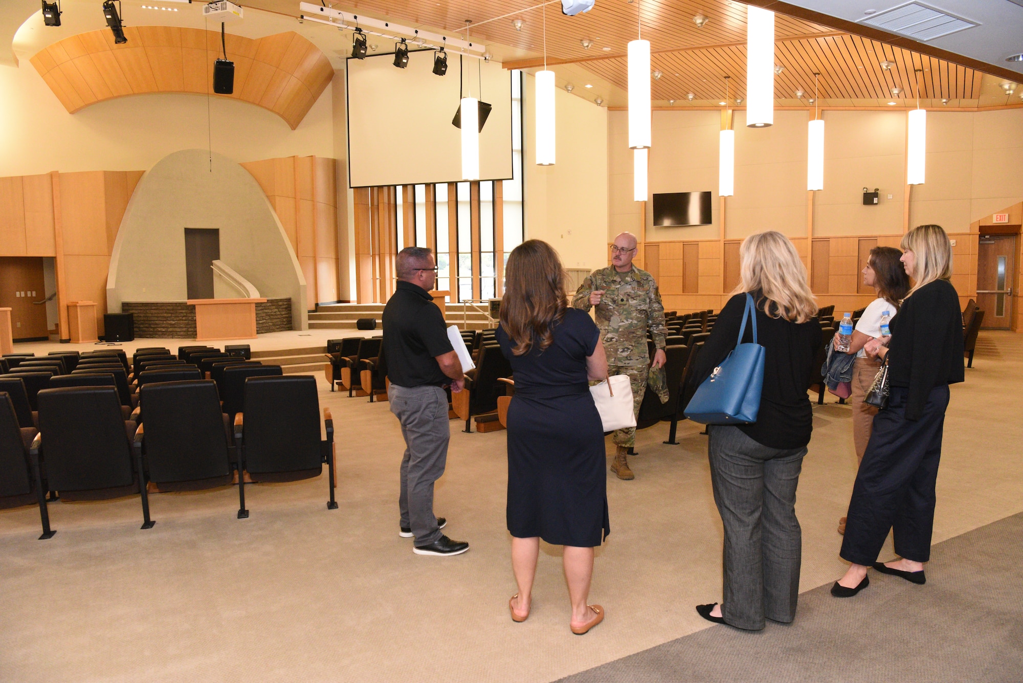 Lt. Col. James Galyon, 51st Fighter Wing chaplain, center, provides an Osan Air Base Chapel orientation to Lori Schneider, second from right, and Chris McCool, left, Pacific Air Forces command team spouses, during a visit to the Republic of Korea, May 21, 2024.