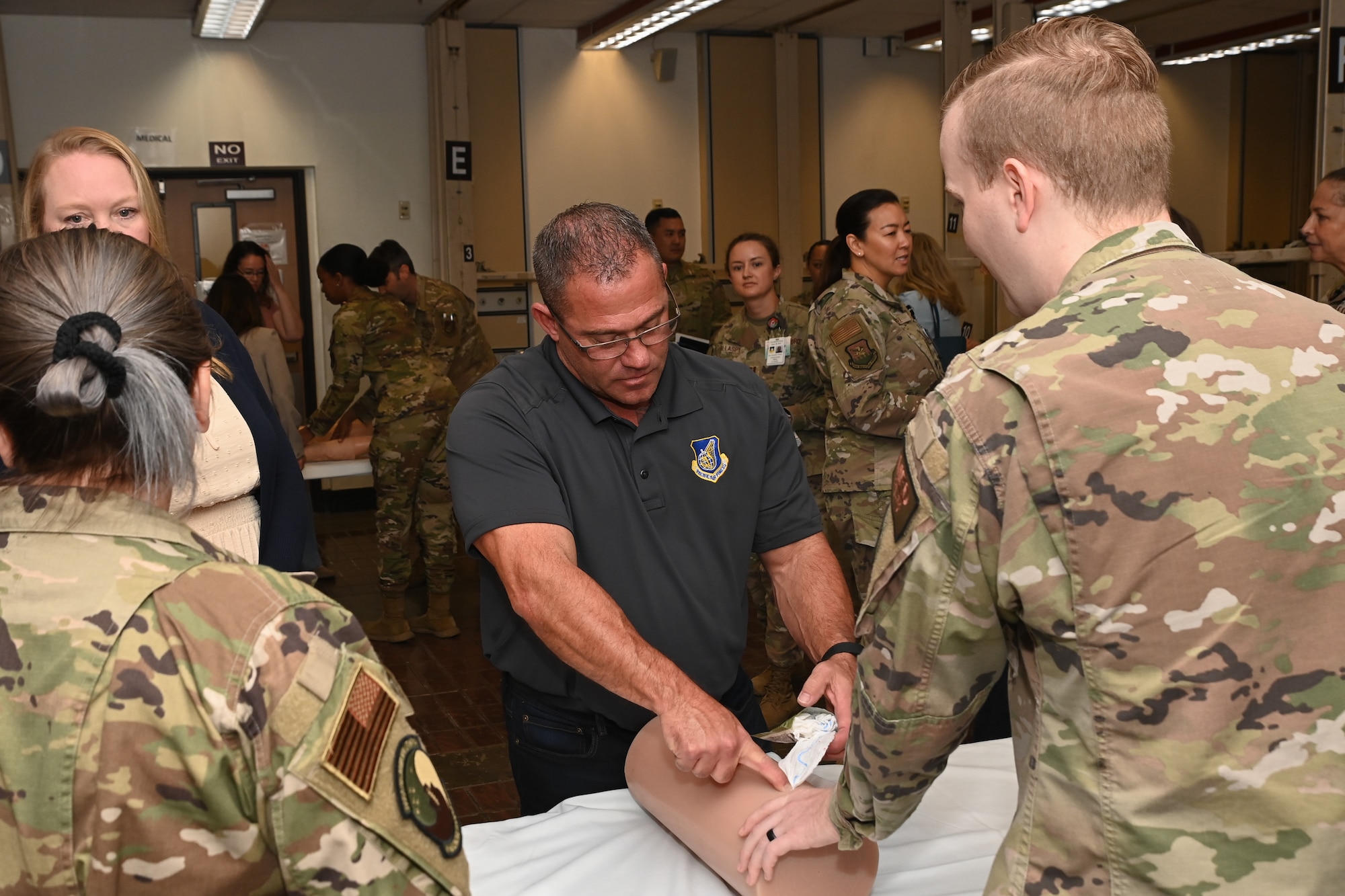 Chris McCool, Pacific Air Forces command team spouse, participates in a triage orientation at the 51st Medical Group during a visit to Osan Air Base, Republic of Korea, May 23, 2024.