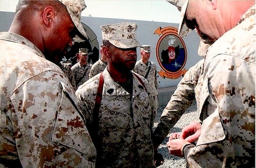 U.S. Marine Corps Master Gunnery Sgt. Terrail Dickerson, Marine Corps Detachment Goodfellow Air Force Base Fire Company senior enlisted advisor, depicted in one of his promotion ceremonies, Camp Leatherneck, Afghanistan, 2011. Dickerson has served 30 years in the Marine Corps and served at various duty stations across the globe. (Courtesy photo)