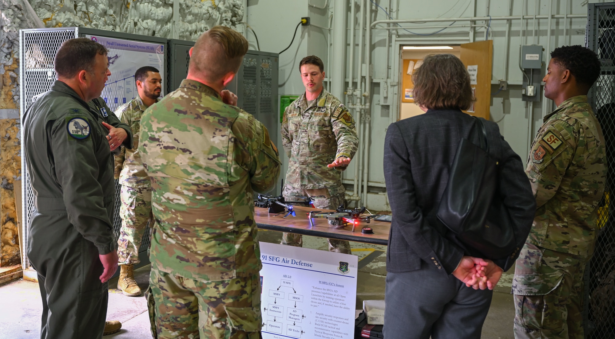 Attendees of the 2024 Air Force Global Strike Command Senior Leader Conference receive a brief on quad-copter unmanned aircraft system (UAS) capabilities at Minot Air Force Base, May 22, 2024. The UAS was displayed alongside other equipment used by security forces members who safeguard Minot AFB.