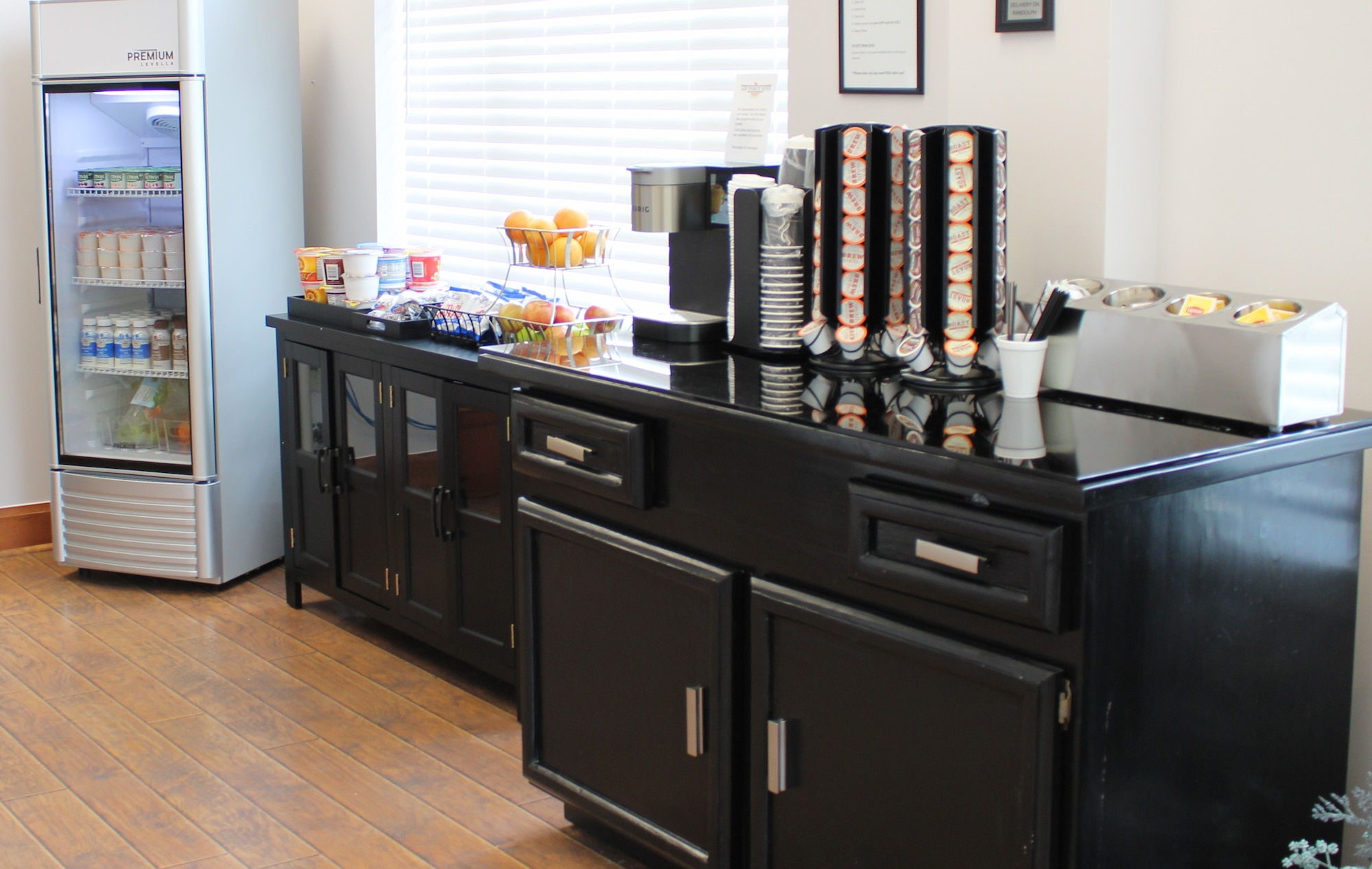 lounge area with refrigerated juices, milks and yogourt, as well as breakfast cereal and pastry area.