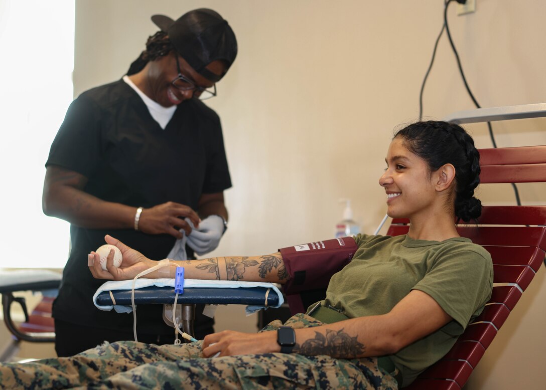 U.S. Marine Corps Sgt. Zaret Evans, a non-commissioned officer in charge with the Installation Personnel Admin Center, donates blood during the Armed Services Blood Program drive at Yale Hall on Marine Corps Base Quantico, Virginia, May 16, 2024. The ASBP is the official blood donation program of the U.S. military, which collects, tests, stores, transports and distributes blood products to military locations around the world for a variety of patients. (U.S. Marine Corps photo by Lance Cpl. David Brandes)