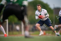 Man runs with football