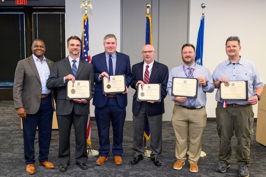 Naval Surface Warfare Center, Philadelphia Division (NSWCPD) award winners at the 2024 Philadelphia Federal Executive Boards (FEB) Excellence in Government Awards Ceremony display their award certificates with NSWCPD Technical Director, Nigel C. Thijs, SES, in Philadelphia May 2, 2024. Five NSWCPD employees received awards at the FEB ceremony that recognizes high-performing federal employees in their local communities and highlight innovative efforts that advance the missions of federal agencies. (U.S. Navy Photo by Chief Mass Communication Specialist Chad M. Butler)