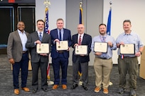 Naval Surface Warfare Center, Philadelphia Division (NSWCPD) award winners at the 2024 Philadelphia Federal Executive Boards (FEB) Excellence in Government Awards Ceremony display their award certificates with NSWCPD Technical Director, Nigel C. Thijs, SES, in Philadelphia May 2, 2024. Five NSWCPD employees received awards at the FEB ceremony that recognizes high-performing federal employees in their local communities and highlight innovative efforts that advance the missions of federal agencies. (U.S. Navy Photo by Chief Mass Communication Specialist Chad M. Butler)