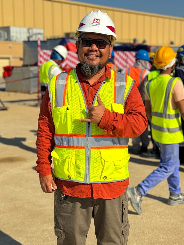 Man posing for a photo wearing safety gear.