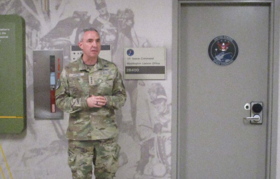 A four star generaL sppeaking to a gethering at the Pentagon.