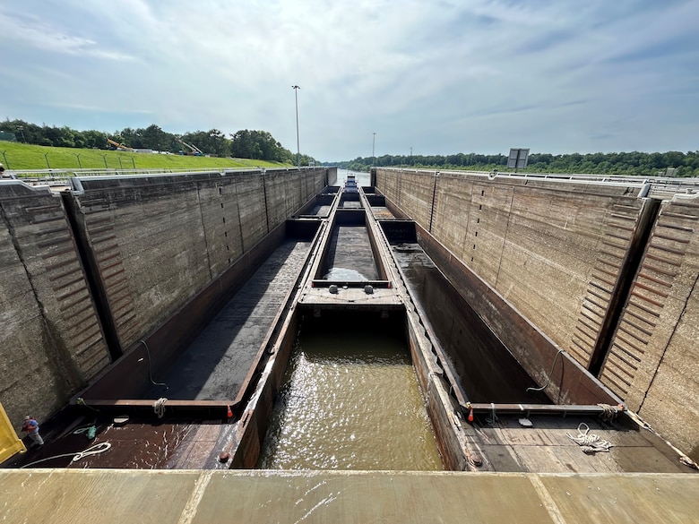 Picture of a barge going through a lock.