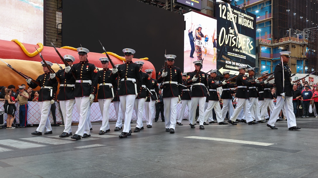 U.S. Marines with the Marine Corps Silent Drill Platoon perform during the “Once a Marine, Always a Marine” formation in Times Square as a part of Fleet Week New York (FWNY) 2024, May 22, 2024. FWNY, now in its 36th year, is a time-honored celebration of the sea services that brings the citizens of New York City and the surrounding tri-state area together with Marines, Sailors, and Coast Guardsmen. Throughout the week, participants can tour ships, experience military static displays, and see drill and musical performances that showcase the expertise, excellence, and patriotism of America’s maritime services. (U.S. Marine Corps photo by Lance Cpl. Sarah Pysher)