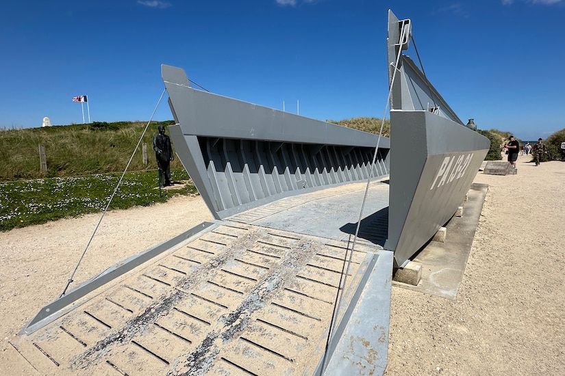 A landing craft is in position on a beach.