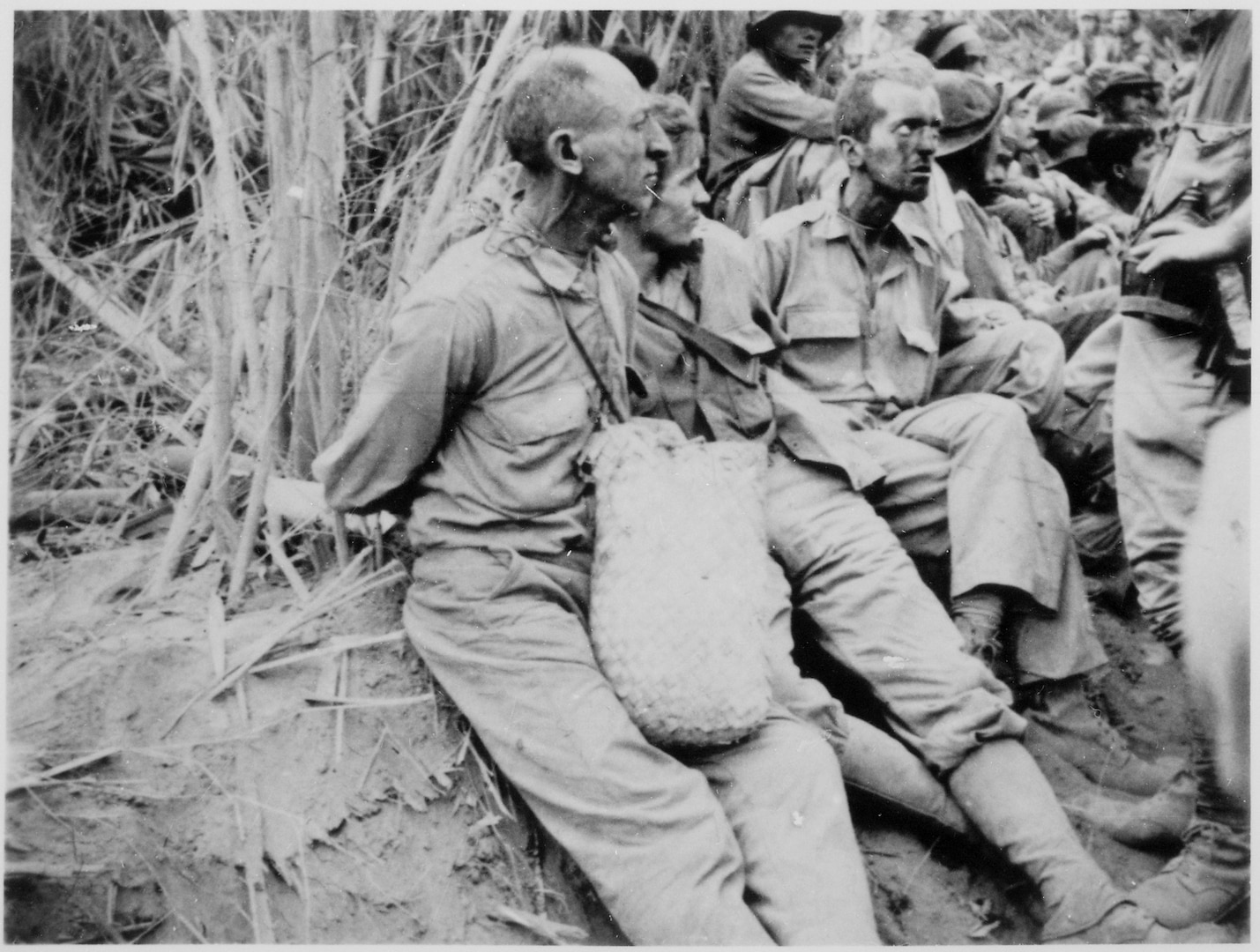 A photo from the U.S. National Archives of prisoners along the Bataan death march. The April 9, 1942 surrender of more than 75,000 American and Philippine troops was the largest in U.S. history. An estimated 11,000 American and Philippine troops died along the way of exhaustion or execution. U.S. National Archives photo (NAID: 532548)