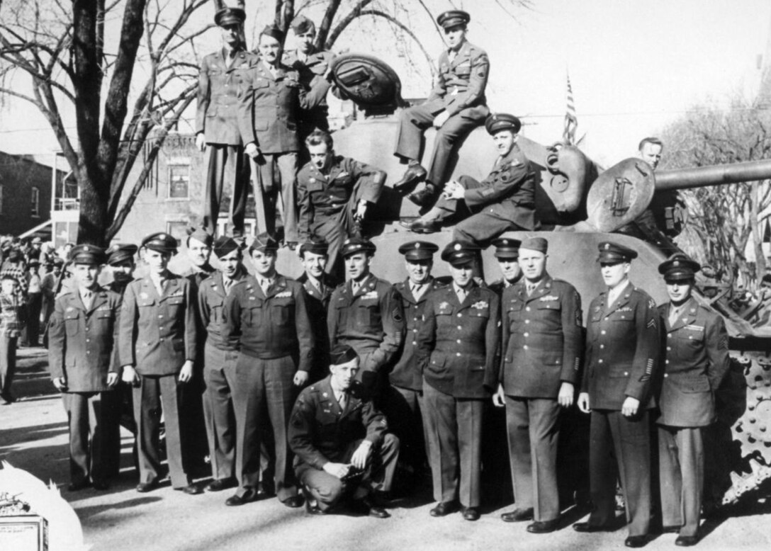 Surviving members of the “Janesville 99,” a Wisconsin National Guard tank company that was sent to Luzon, Philippines as part of a defensive force, reunited for a photo after World War II. Rock County Historical Society photo