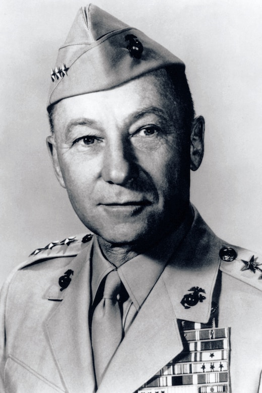 Close-up black and white photo of a person in a military uniform.