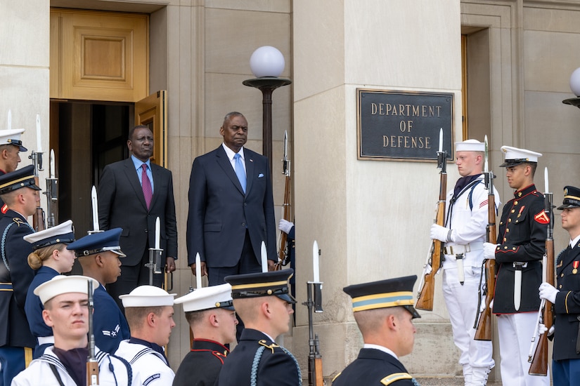 Secretary of Defense Lloyd J. Austin III and Kenyan President William Ruto stand on the steps of Pentagon during a ceremony.