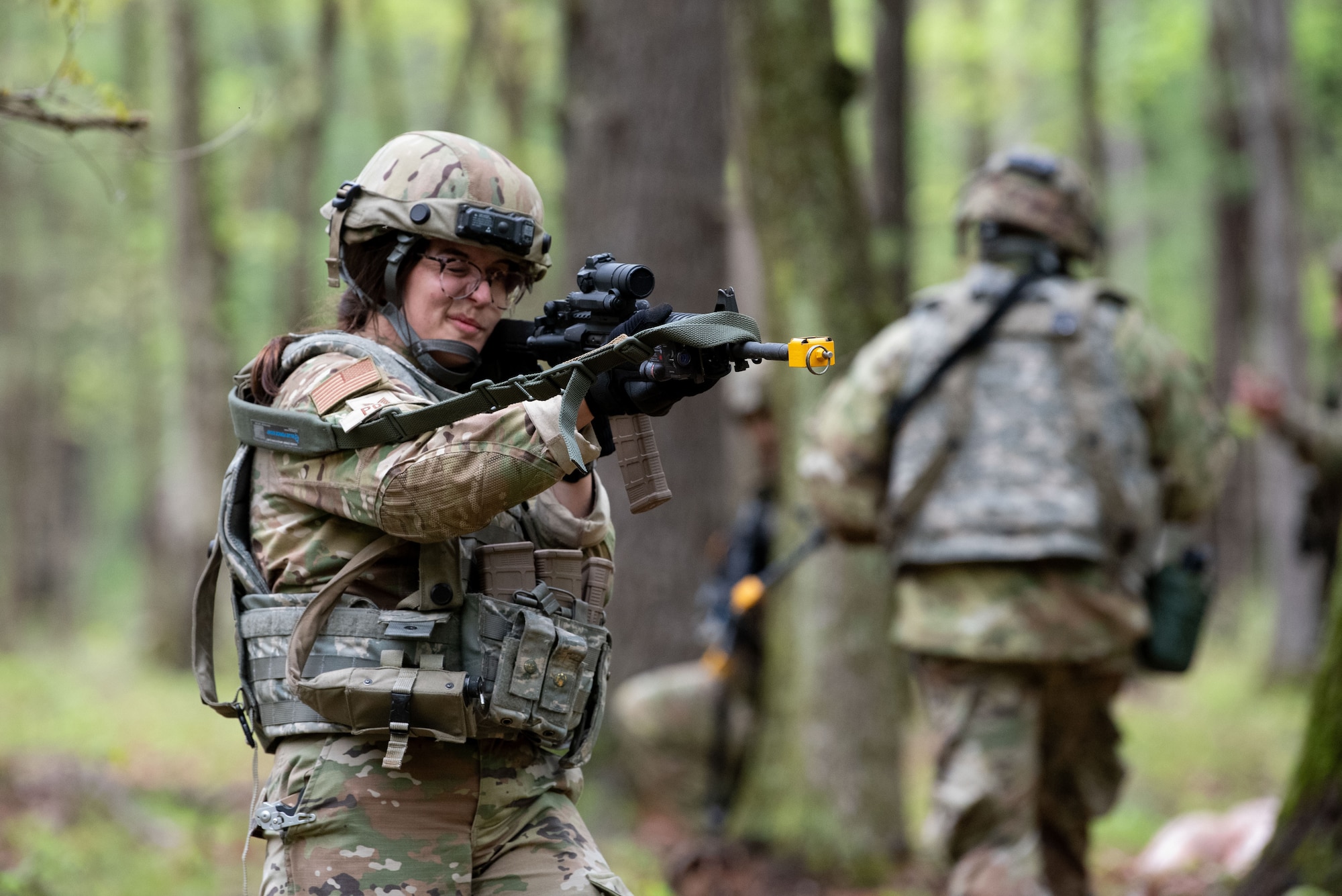 U.S. Air Force Tech. Sgt. Emylee Porter, a 157th Civil Engineer Squadron member, practices her ground combat skills in a simulated combat scenario during the 2024 Region One Prime Base Engineer Emergency Force (BEEF) Field Training Exercise on Fort Devens, Massachusetts, May 16, 2024.