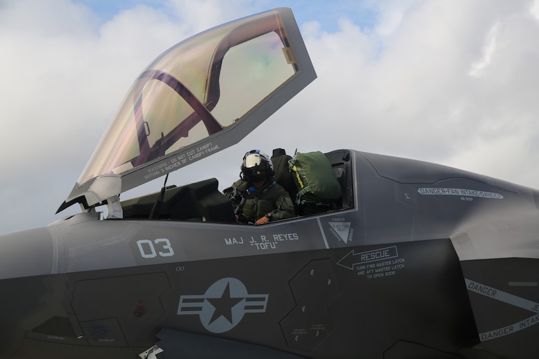 U.S. Marine Corps Maj. John-Paul Reyes, an F-35B Lightning II pilot, with Marine Fighter Attack Squadron (VMFA) 214, Marine Aircraft Group 13, 3rd Marine Aircraft Wing, straps into the seat of an F-35B Lighting II before a transpacific flight from Camp Blaz, Guam, to Royal Australian Air Force Base Tindal, Australia, May 19, 2024.  VMFA-214 deployed more than 200 Marines and eight F-35B Lightning II aircraft from Marine Corps Air Station Yuma, Arizona, to RAAF Base Tindal, Australia, to conduct bilateral training with the RAAF No. 3 Squadron and No. 75 Squadron. As part of I Marine Expeditionary Force, 3rd MAW persistently trains in the Indo-Pacific, maintaining a forward presence and enduring commitment to our allies and partners in the region. (U.S. Marine Corps photo by Cpl. Nicholas Johnson)