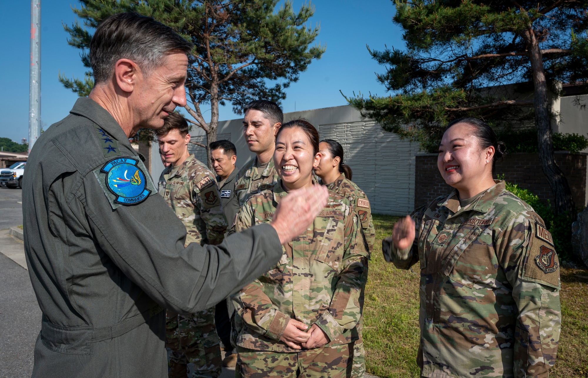 U.S. Air Force Gen. Kevin B. Schneider, Pacific Air Forces commander, coins Airmen during an immersion at Osan Air Base, May 23, 2024. This was Schneider's first visit to Osan since taking command of PACAF in February 2024. (U.S. Air Force photo by Senior Airman Sabrina Fuller-Judd)