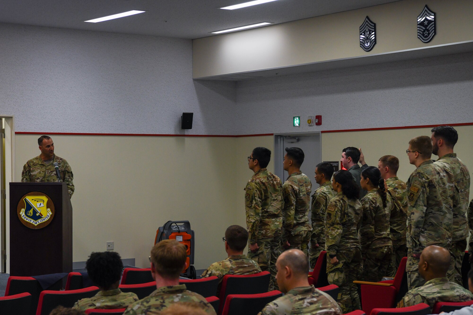Newly inducted NCO's stand at attention reciving their charges