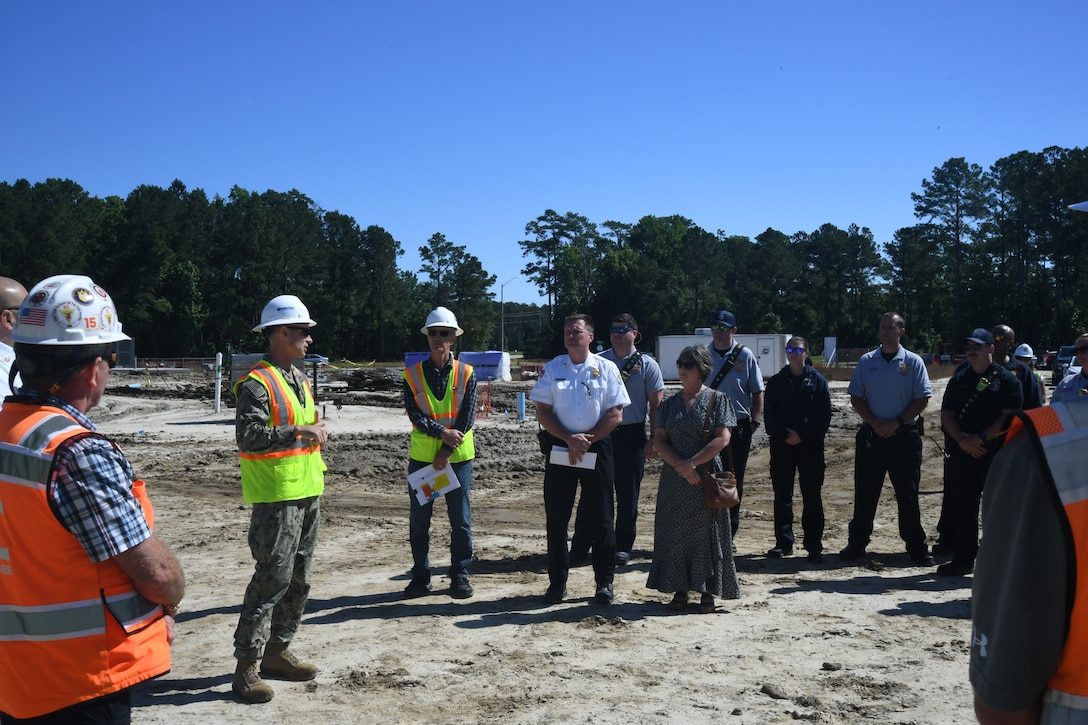 United States Navy Capt. David Jayne, commanding officer of OICC Florence provides opening remarks during the “topping out” ceremony on May 21, 2024 for Military Construction Project 1518 – the new Hadnot Point Fire Station on Marine Corps Base Camp Lejeune.



“Topping out” ceremonies are informal ceremonies used to commemorate a construction milestone for the completion of the foundational structure of a building.