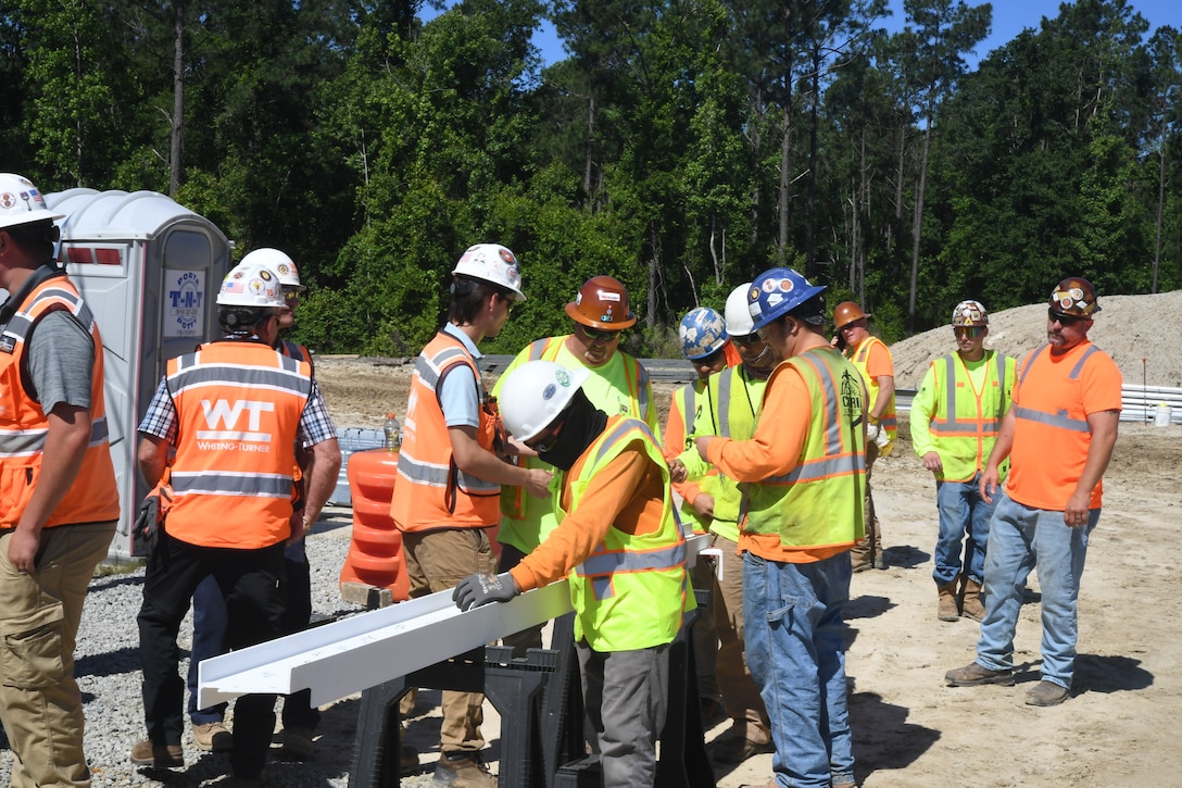 Construction crews from Whiting-Turner Contracting Company take turns signing the metal beam during the “topping out” ceremony for Military Construction Project 1518, the new Hadnot Point Fire Station aboard Marine Corps Base Camp Lejeune on May 21, 2024. 



Navy Facilities Engineering Systems Command awarded the $17,485,440 project to Whiting-Turner Contracting Company in September of 2020 and the “topping out” ceremony marks the 317th day of construction.