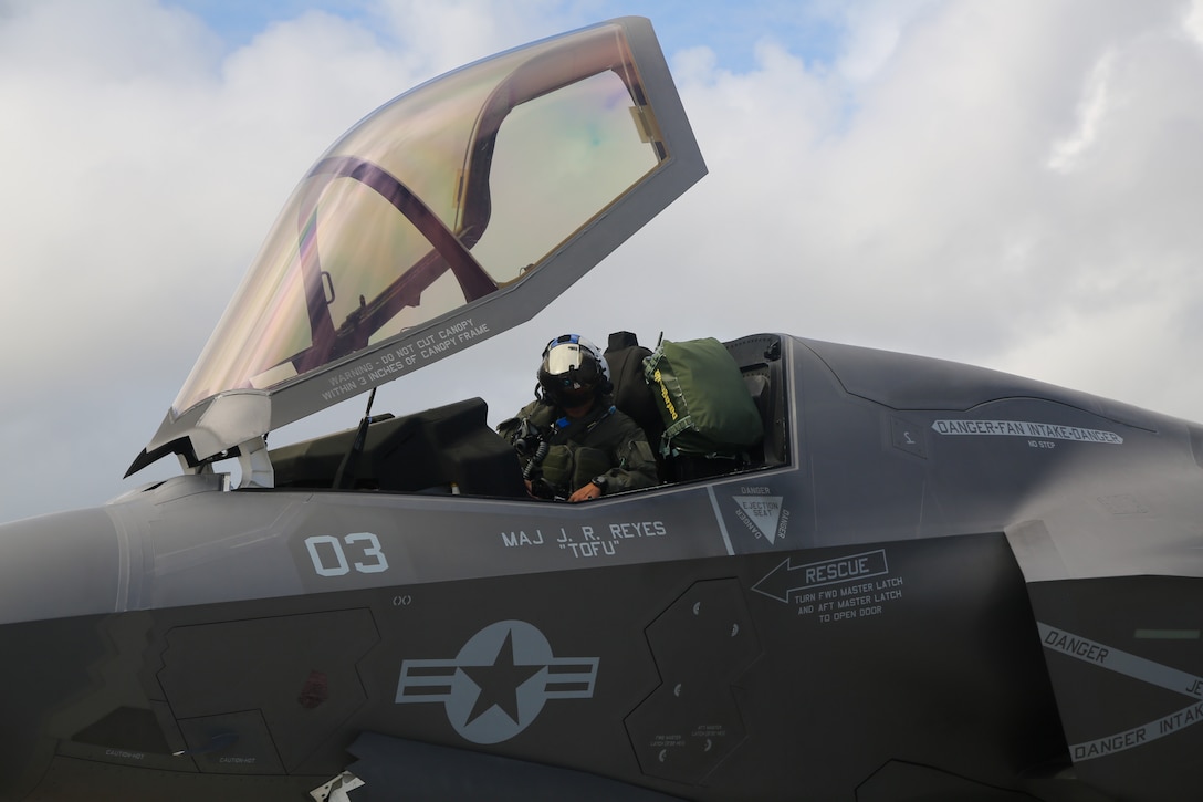 U.S. Marine Corps Maj. John-Paul Reyes, an F-35B Lightning II pilot, with Marine Fighter Attack Squadron (VMFA) 214, Marine Aircraft Group 13, 3rd Marine Aircraft Wing, straps into the seat of an F-35B Lighting II before a transpacific flight from Camp Blaz, Guam, to Royal Australian Air Force Base Tindal, Australia, May 19, 2024.  VMFA-214 deployed more than 200 Marines and eight F-35B Lightning II aircraft from Marine Corps Air Station Yuma, Arizona, to RAAF Base Tindal, Australia, to conduct bilateral training with the RAAF No. 3 Squadron and No. 75 Squadron. As part of I Marine Expeditionary Force, 3rd MAW persistently trains in the Indo-Pacific, maintaining a forward presence and enduring commitment to our allies and partners in the region. (U.S. Marine Corps photo by Cpl. Nicholas Johnson)